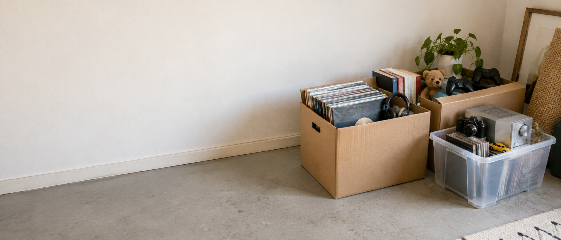 Boxes of records, media, electronics and other items ready for assessment